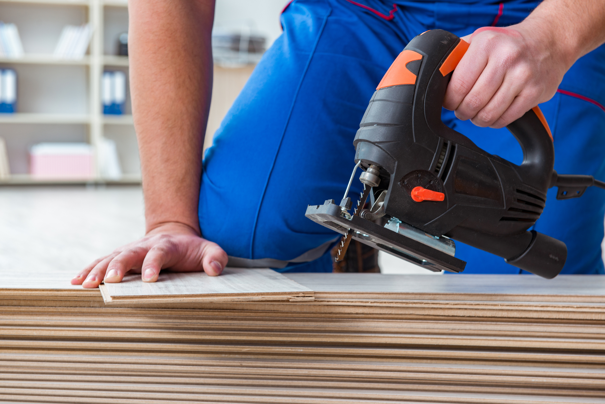 Worker Working On Floor Laminate Tiles